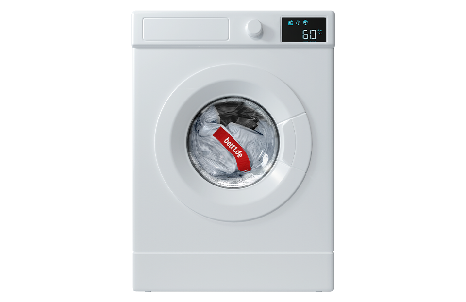 Imagen de una lavadora, resaltando la facilidad para lavar su funda extraíble del colchon bodyguard box spring de bett1.es