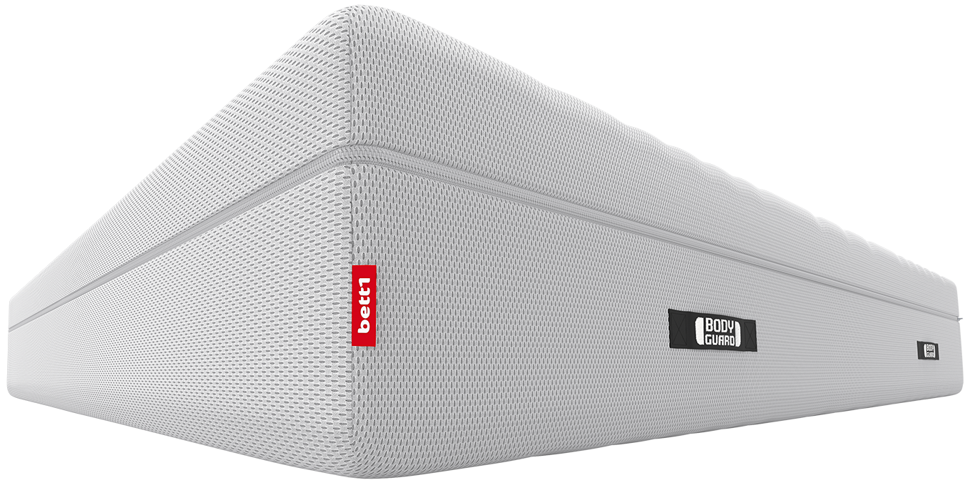 Imagen lateral del colchón BODYGUARD® Boxspring de bett1.es, mostrando su diseño robusto y su etiqueta roja distintiva.