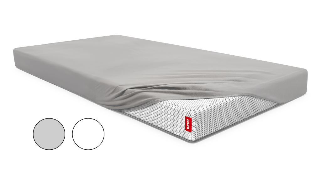 Sábana bajera BODYGUARD® en color gris, colocada sobre un colchón, con opción de selección de color.