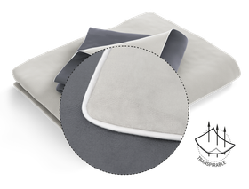 Funda nórdica gris y blanca doblada, con círculo de detalle que muestra el borde blanco.