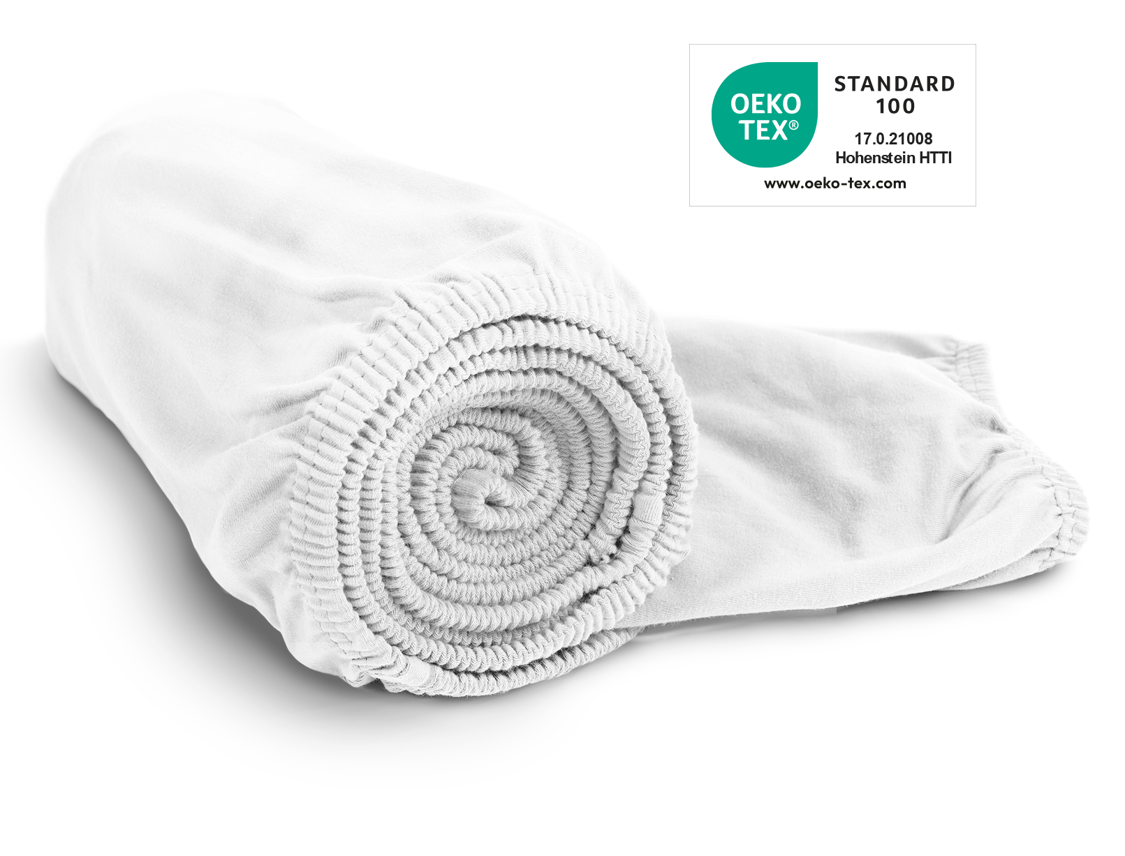 La sábana ajustable de jersey BODYGUARD® en blanco enrollada. Sello Oeko-Tex® Standard 100.