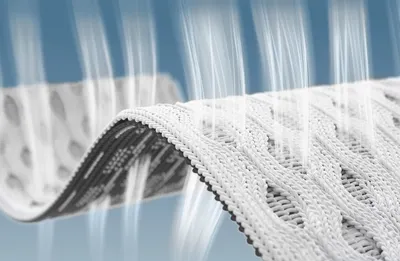 Grafik: Ein Luftstrahl strömt durch die drei Stoffschichten des HyBreeze Funktionsbezug